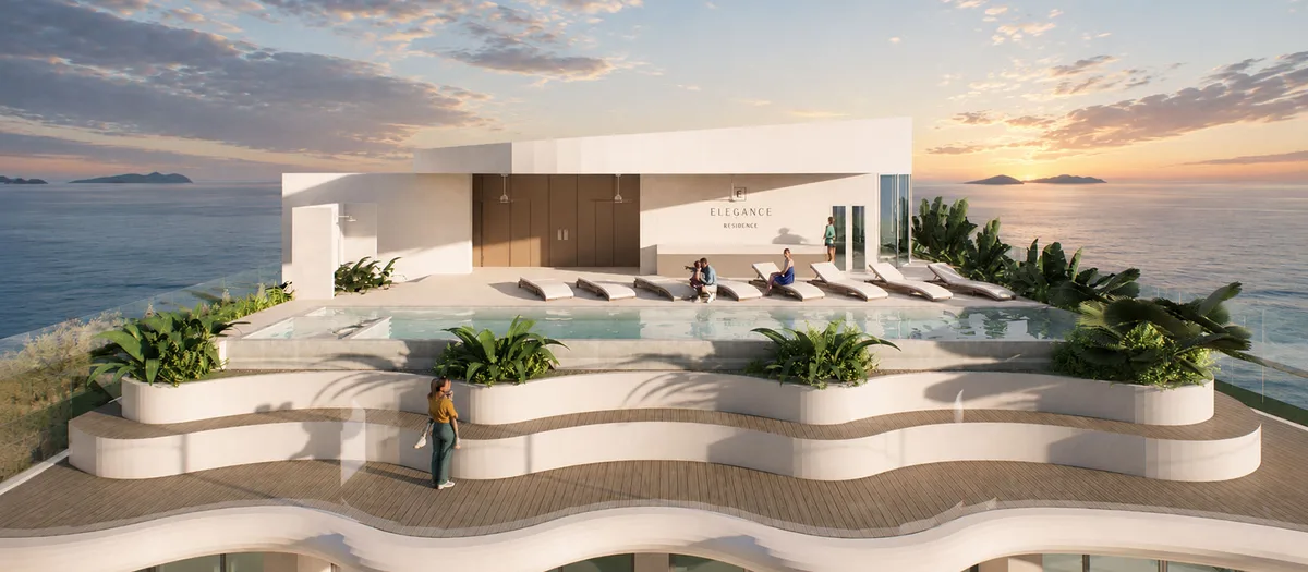 Rooftop pool deck at sunset looking out over the Gulf
