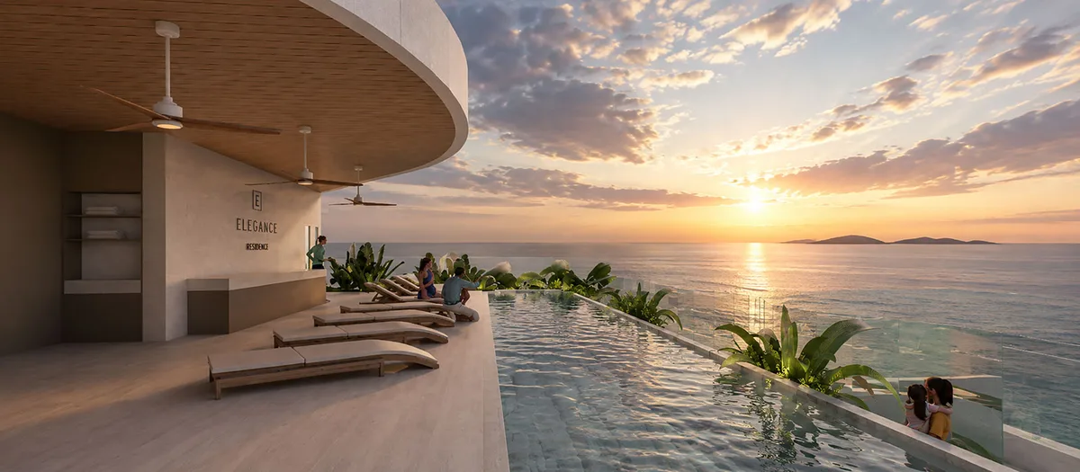 Infinity pool and loungers facing the sunset