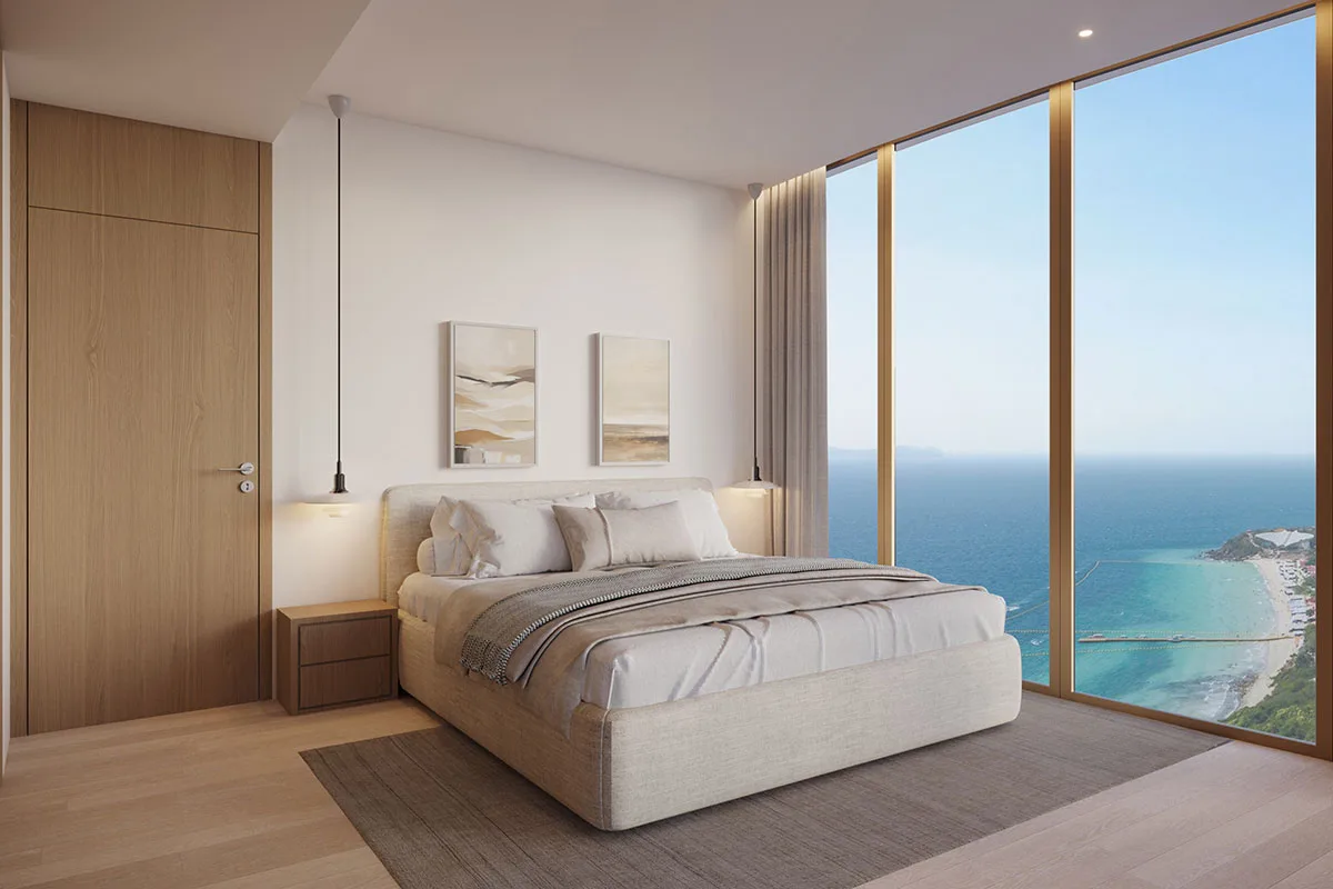 Bedroom with a floor-to-ceiling view over the beach