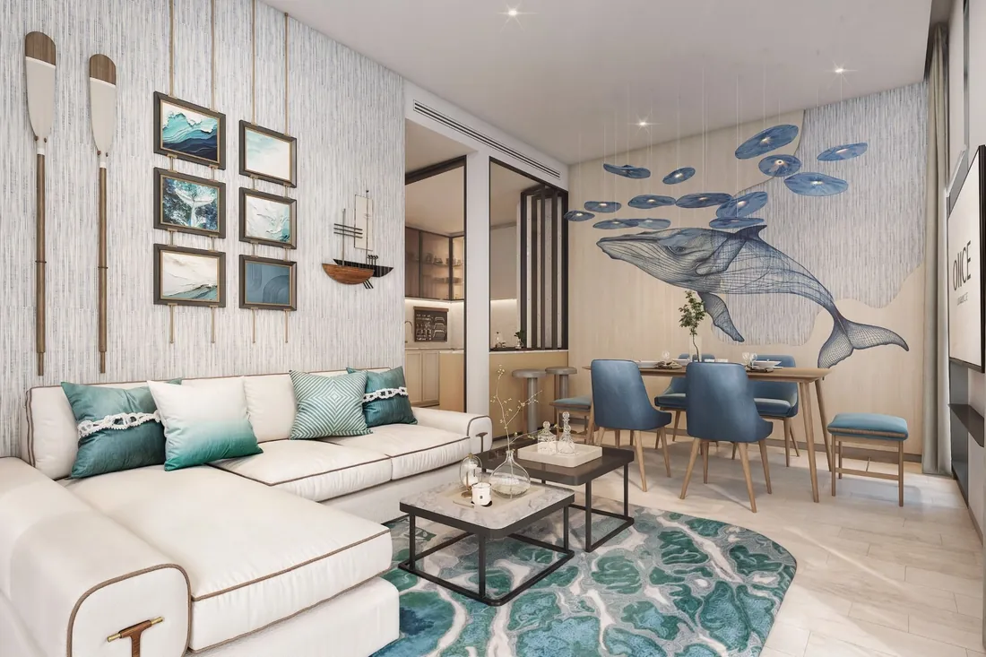 Two-bedroom living room with feature artwork and sea views
