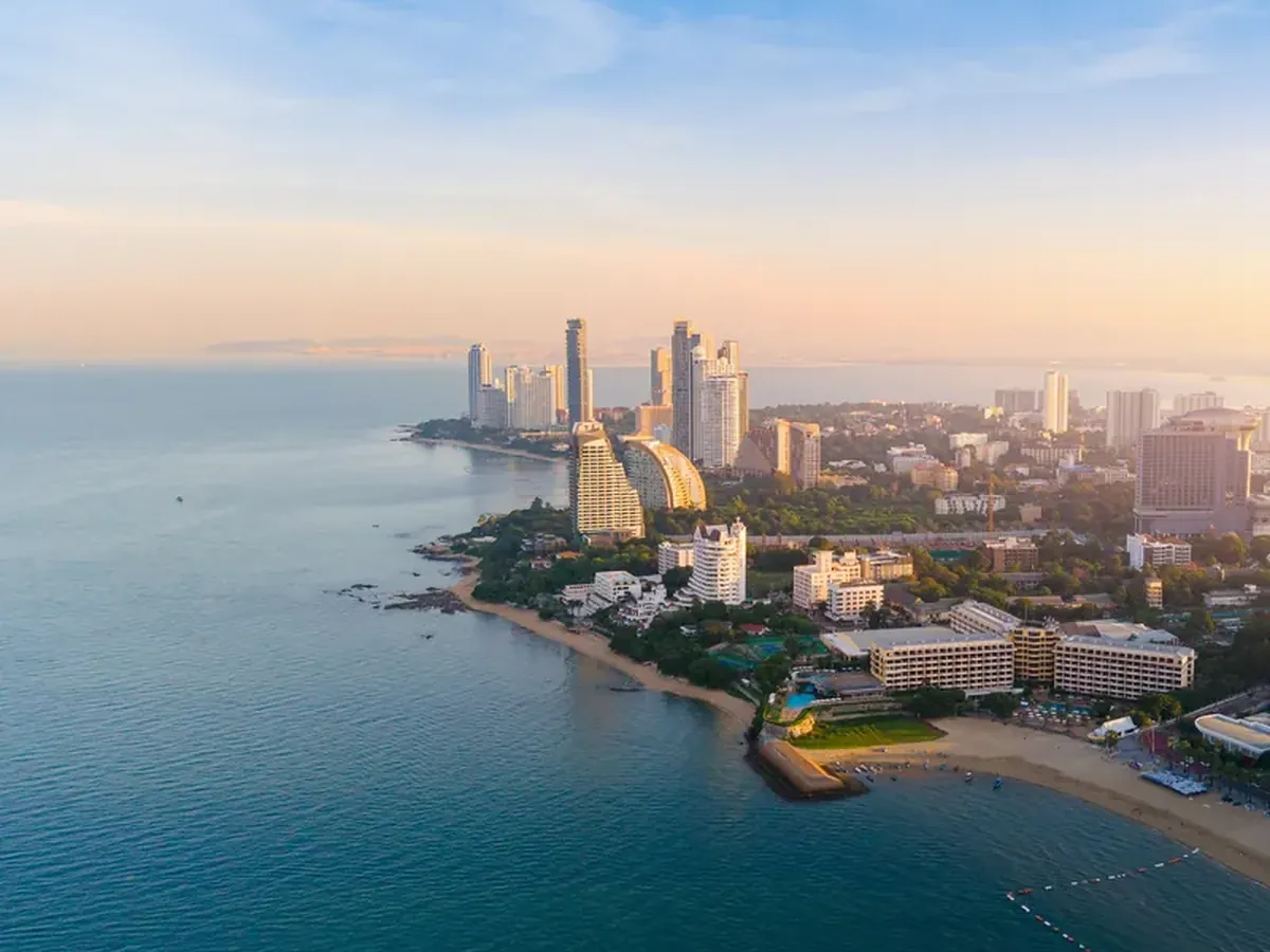 Aerial view of the Wongamat headland and Pattaya bay coastline at sunrise