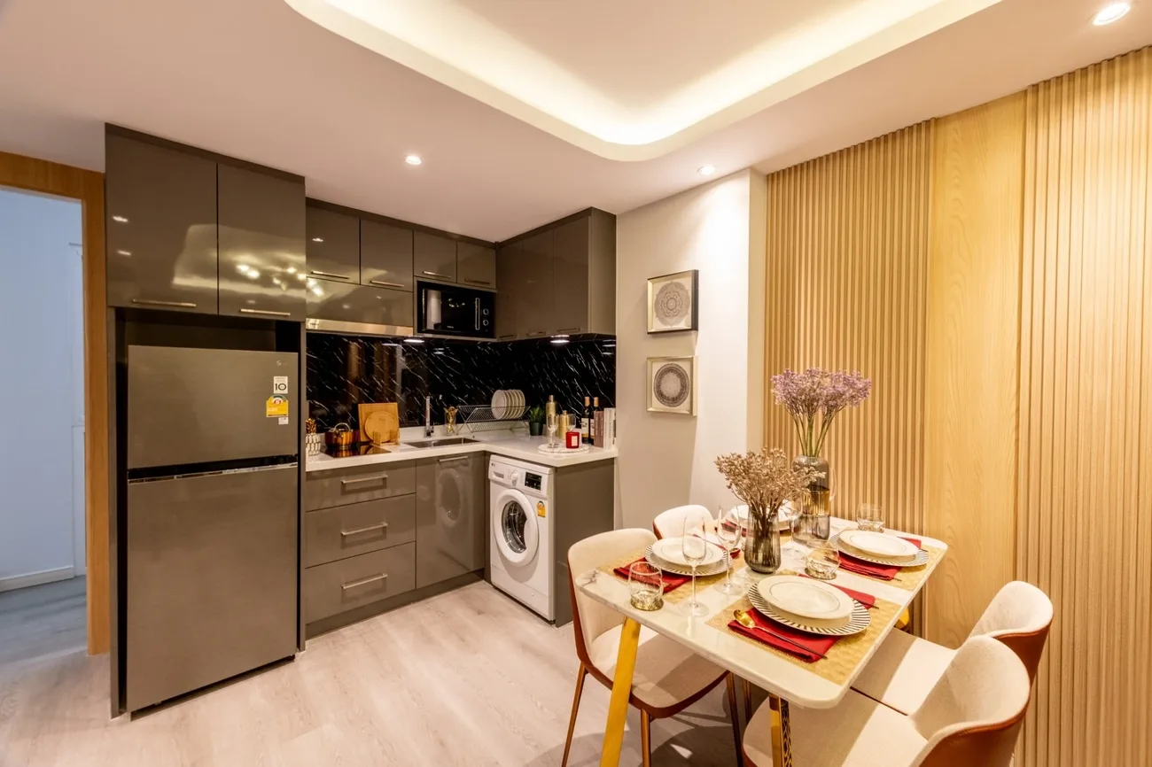 Fully furnished show suite kitchen and dining at Pristine Park 3