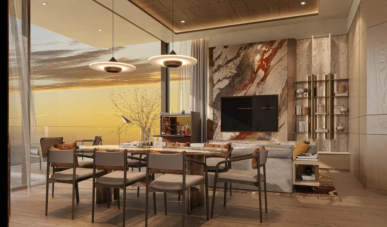 Dining room opening onto a sunset sea view