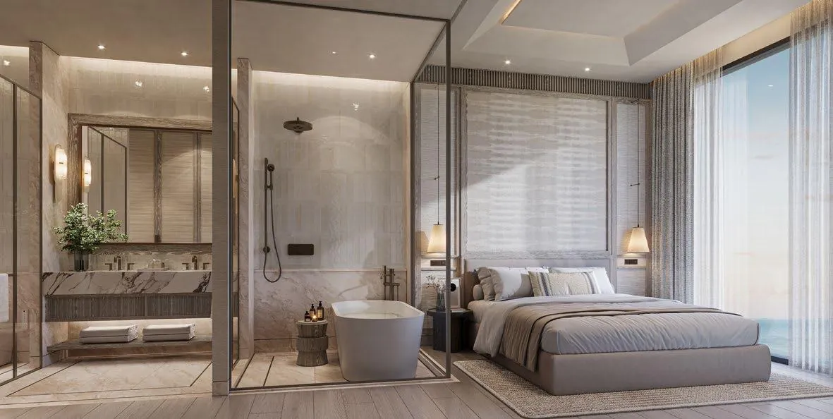 Master bedroom with a freestanding bath and sea view